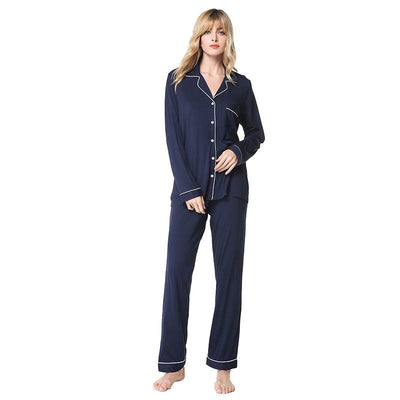 A photo of a woman in a blue navy bamboo pyjama set, perfect for women's sleepwear that offers both comfort and sustainability with the use of eco-friendly bamboo fibers